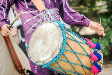 Man drumming in Indian wedding ceremonies, selective focus.