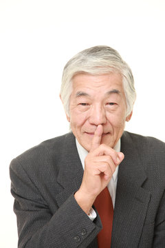senior Japanese businessman whith silence gestures