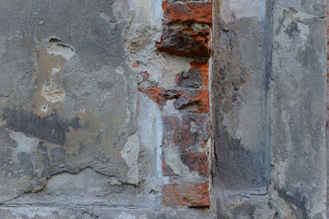 Wall fragment with attritions and cracks
