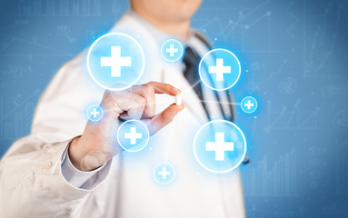 A doctor showing a pill with crosses