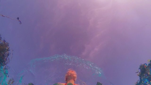 Woman Swimming Under Water In The Pool, Slow Motion Shot 
