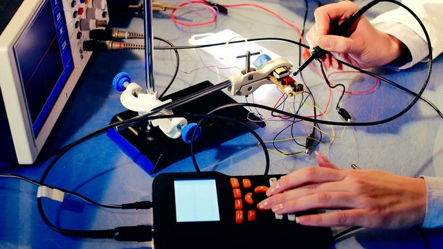 Woman In The Electronics Lab