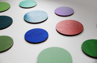 Photo of colorful wooden wheels, laser cut and hand-painted with acrylic paints