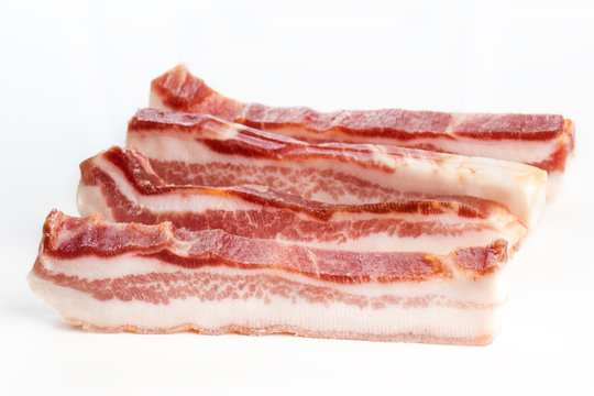 Iberian raw rashers of bacon cut ready for frying