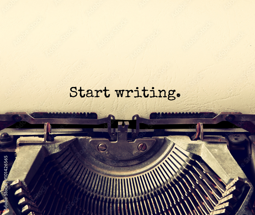 Fototapete close up image of typewriter with paper sheet and the phrase: start writing . copy space for your te