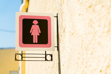 Public restroom signs with a lady symbol