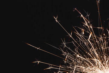 Bright sparks on black background.