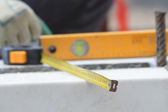 Leveling on a construction site. Shallow depth of filed.