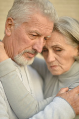 Mature couple near wall