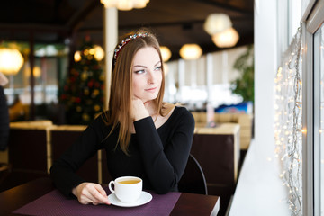 Woman having cup of tea