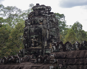 Fototapeta premium Face stone of ancient Bayon Temple in Angkor Wat, Siem Reap, Cam