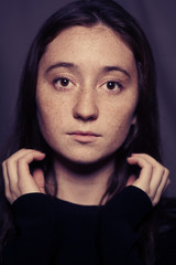 Fototapeta premium Portrait of a young girl with freckles