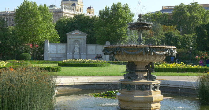 Vienna, Austria. Popular Volksgarten park with fountains, ponds, roses and threes in summer.