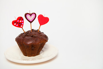Chocolate muffins on white background for Valentine's day. Selec