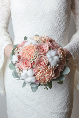 Peach wedding bouquet with cotton flowers