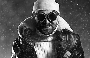 brutal portrait of a bearded man winter snow goggles