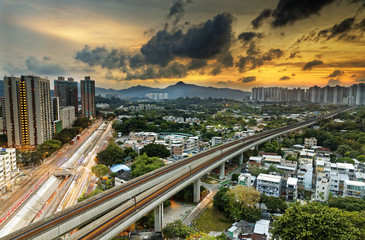 Fototapeta na wymiar hong kong urban downtown and sunset speed train, Long Ping