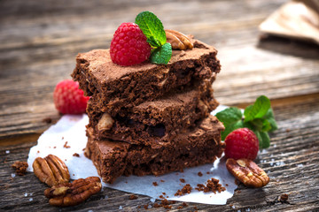 Brownies on wooden background