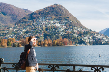 Fototapeta na wymiar Young girl looking at the panoramic scenery. Lugano, Switzerland