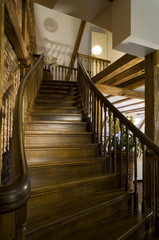 Obraz premium Modern wooden interior interior in private house. Wooden stairs