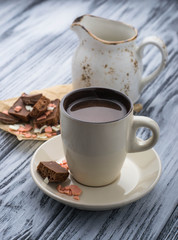 Fototapeta na wymiar Cup of hot chocolate and chocolate chips