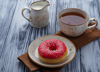 Fototapeta na wymiar Donut and cup of tea