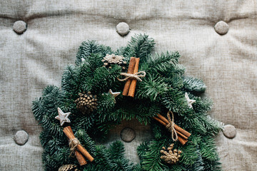 Christmas wreath with decoration  cinnamon on grey