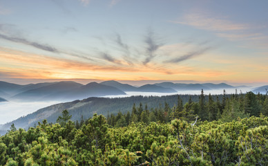 A sunset with fog at mountains