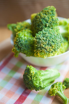 Raw broccoli on wooden background