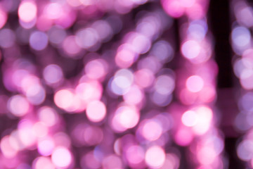 abstract blur blackground with bokeh defocused lights in violet color
