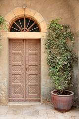 Fototapeta na wymiar Antique wooden door in the Franciscan monastery on Mount Tabor, Israel.
