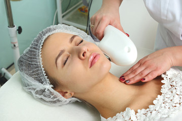 Naklejka premium Woman having facial hair removal laser.