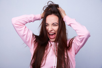Fototapeta premium beautiful brunette with straight hair pulls hair