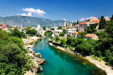 Fototapeta na wymiar Old bridge and emerald Neretva river in Mostar, Bosnia and Herzegovina