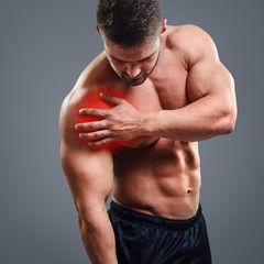 Fototapeta na wymiar Ahtletic muscle man Shoulder pain