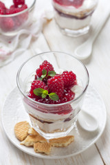 cheesecake with raspberries, mint in glass
