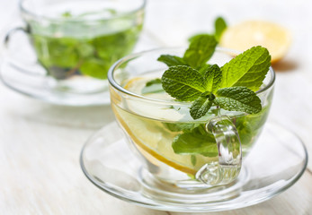 cups of tea with fresh mint and lemon - 101457107