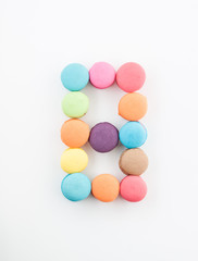 Fototapeta na wymiar colorful macarons arrangment is number eight