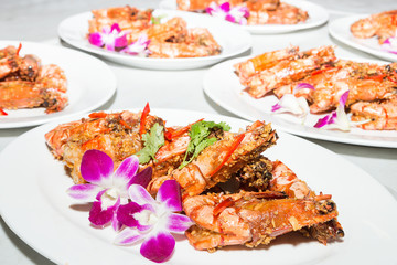 shrimps done with garlic, onion, and olive oil in the grill