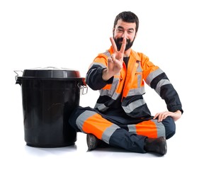 Garbage man doing victory gesture