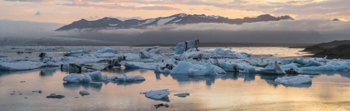 pink sunrise in icebergs lagoon in Iceland