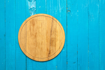 cutting board on a blue wooden background