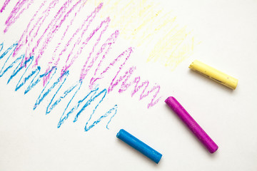 multicolored crayons on a white background