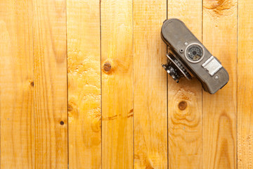 old camera on a wooden background