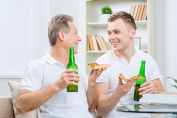 Father and his adult son drinking beer 