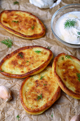 Mashed Potato Fritters with Sour Cream on wooden rustic background