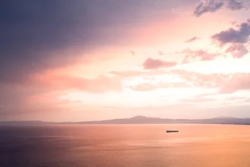Türaufkleber Meer / Sonnenuntergang Dramatic sunset sky with ship