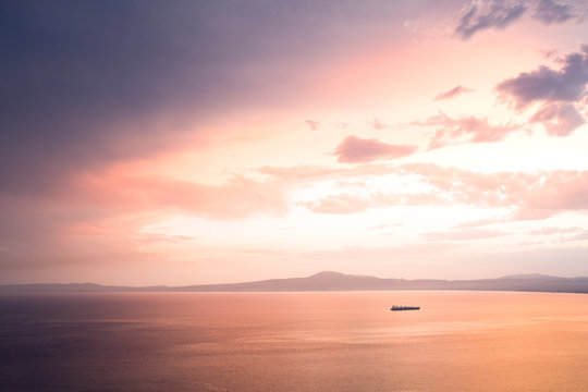 Fototapeta Dramatic sunset sky with ship
