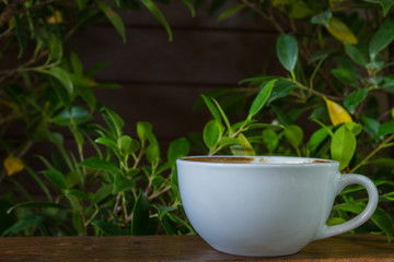 White coffee cup on wooden table