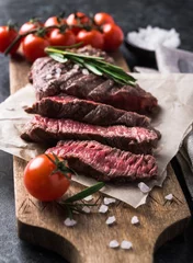 Garden poster Steakhouse Grilled beef steak with rosemary and salt on cutting board